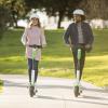 Stock image of people riding Lime Scooters