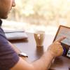 Person scrolling on tablet