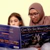 Student reads with a child