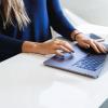 Person working on laptop at a desk