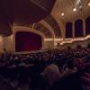 Audience members wait for speaker to take the stage in Macky Auditorium