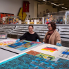 CU Art Museum employees Maggie Mazzullo and Hope Saska working in the museum
