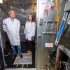 researchers stand inside the 10m3 bioaerosol chamber on campus