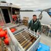 alumnus Markos Scheer with kelp spools