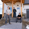 Matt Morris, George Kurtz and Daniel Donado Quintero stand in front of Morris's new home