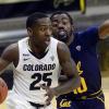 Colorado's McKinley Wright IV, left, drives past a Cal player during a Pac-12 Conference basketball game