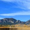 A wide image of the CU Boulder South property with the Flatirons in the background