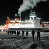 People walk across the ice  toward Polarstern. Photo by Michael Gutsche.