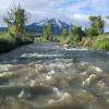 With Colorado's Mount Sopris in the background, water flows along the Roaring Fork River