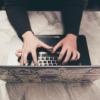 person typing on laptop