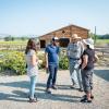 Aaron Treher and Molly McDermott speak with the Cargills at their farm.