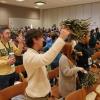 Incoming students shake pompoms during the spring 2018 New Student Welcome Day.