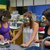 Glenwood High School senior Keyla Contreras and Summit County High School students Lizbeth Serrano and Nancy Higuera in an advanced chemistry lab at CU Boulder last summer.