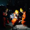 Construction workers at night