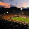Fans cheer as the sun sets at Folsom Field
