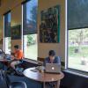 Students studying at tables in Norlin Library