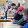 Students studying and working on laptops in Norlin Library