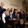 Obama signing the affordable care act