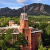 Old Main is seen against the background of the Flatirons