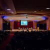 Panelists speak in an auditorium on campus