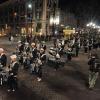 The CU marching band parades down Pearl Street