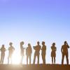 People silhouetted while having a conversation 