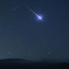 Shoting star across a night sky