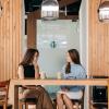 two people networking over coffee