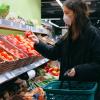 Stock image of a person wearing a face mask in a supermarket