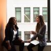 Two young professionals talking