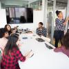 Stock image of women holding a meeting