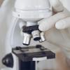 A scientist using a microscope