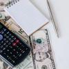 Calculator and money.