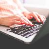 Woman works on laptop