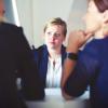 Three women at a meeting.
