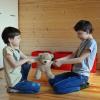 Stock image of two kids fighting over a teddy bear