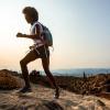 Peyton Thomas running on a trail