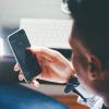 A person holds a cell phone