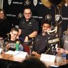 Coach Tad Boyle presents Nick Nelson (third from right) his No. 13 Colorado jersey.