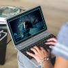 Person using Creative Cloud on a laptop