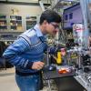 Physics students works in lab.