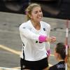 A CU volleyball player wears pink during a match