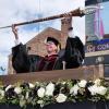Bud Coleman holds the mace during the 2022 commencement ceremony