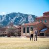 students talking outside on campus