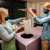 Evan Kirk and Claire Meyer demonstrate how thermal testing for the PortaVax device is set up. (Photo submitted)