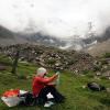 Alice Hill doing research on a mountainside
