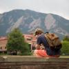 student sitting outside alone on campus