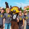 Staff members pose with Chip the buffalo mascot