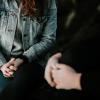 Two people sit near each other. Photo by Priscilla Du Preez on Unsplash