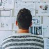 Man looks at project board